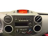 a car dashboard with a clock and various gauges