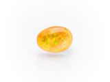 a yellow oplite gems on a white background