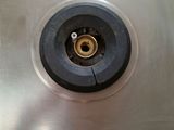 a metal sink with a metal faucet in it