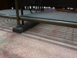 a bench that is sitting on the floor in the room