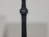 a close up of a smart watch sitting on a table
