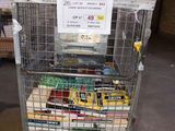 a metal cart with a bunch of books in it