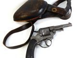 an old gun and a hat on a white surface