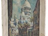 une peinture à l'huile représentant un bâtiment, dans un cadre blanc, sur fond blanc