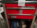 a red tool box with a sign on it