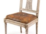 an image of a chair with a seat made of wood and leather