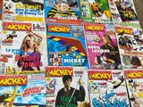 a lot of comic books on the table