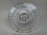a silver plate with a starburst on it
