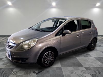 a picture of a silver car parked in a garage