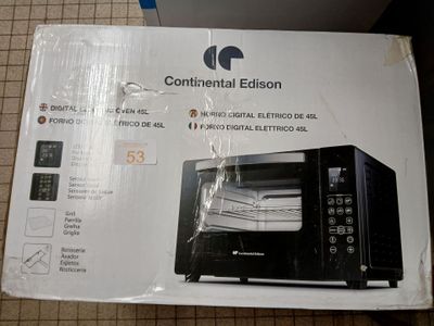 packaging of a black microwave oven sitting on top of a tiled floor