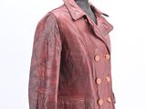 leather jacket on a mannequin stand against a white background