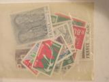 many different stamps in a clear bag on a table