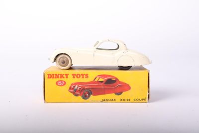 a white toy car sitting on top of a box