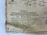 an old map of france on a piece of paper on a table