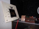 a picture of a painting on a table with a fan in front of it