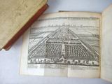 an old book with a picture of a garden on it