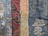 a lot of different colors of ties on a table
