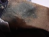 a close up of a person ' s shoe with a tag on it