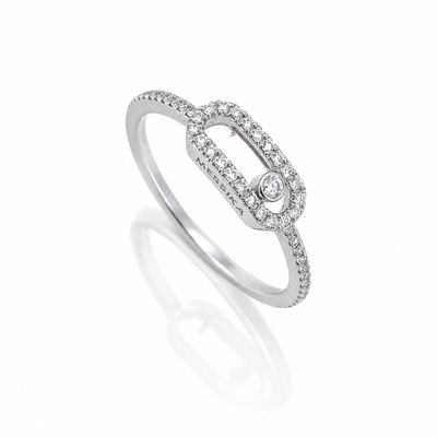 a close up of a diamond ring on a white background