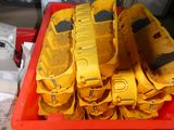 a lot of yellow toy cars in a red container