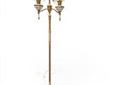 a brass plated floor lamp with three lights and a marble base