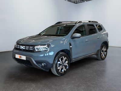 the blue dacia is parked in the garage of a dealers showroom