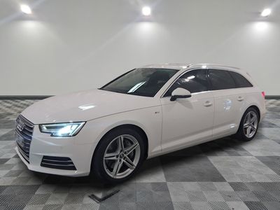 an image of a white audi wagon parked in a garage