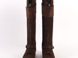 the back view of a pair of brown boots on a white background
