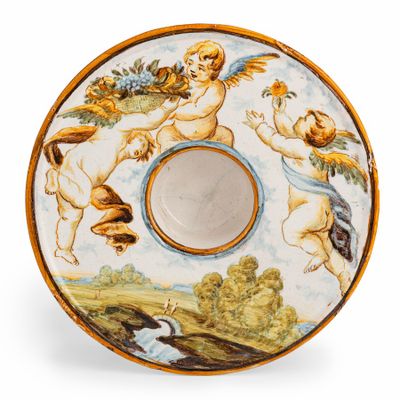a plate with a picture of angels and cherensils on it