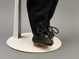 a close up view of a pair of shoes on a stand
