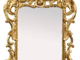 an image of a mirror with a gold frame on a white background