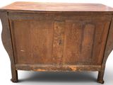 an old wooden cabinet with a drawer on top of it