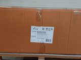 a cardboard box sitting on a pallet in front of a garage door