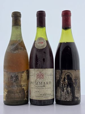 trois bouteilles de vin posées l'une à côté de l'autre sur une table