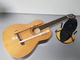 a guitar and a microphone sitting on a table