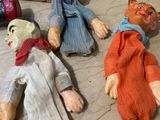 three dolls that are sitting on a counter top