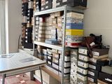 a room with many boxes and a table in it