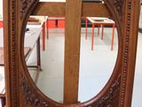 a mirror that is on a stand in a room