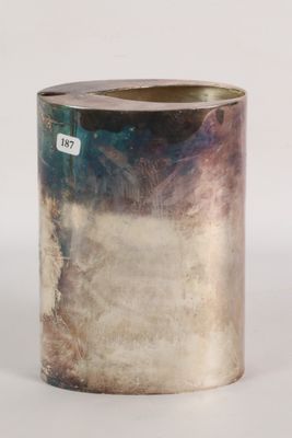 an image of a silver vase sitting on top of a white table