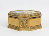 an image of a gold box with a picture of a woman on it