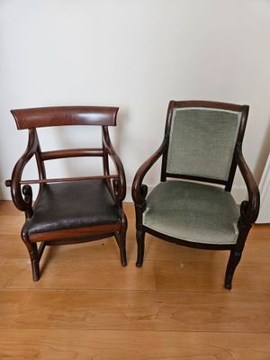 two chairs sitting next to each other on a hard wood floor