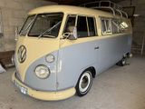 a vw bus that is parked in a garage