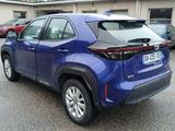 the rear end of a blue toyota rav parked in a parking lot