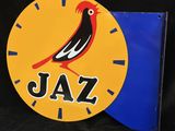 a clock that has a bird on it with the word jazz on it