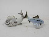 two salt and pepper shakers with fish on them
