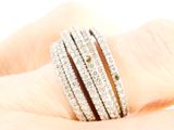 a close up of a person ' s hand with a diamond ring on it