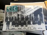 several old photos of men in suits and ties standing in front of a building