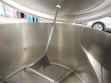 a large metal pot with a spatula in it