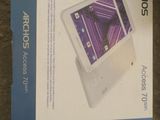 an open box of a tablet computer sitting on top of a table