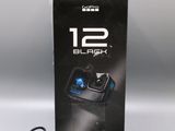 an image of a box with a camera and charger on it
